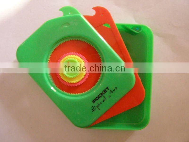 plastic spirograph toys with papers