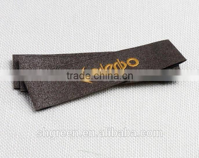 straight cut black background black logo woven label