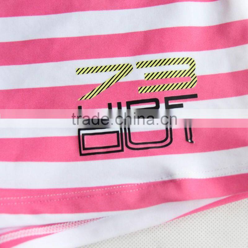 pink and white child swimwear