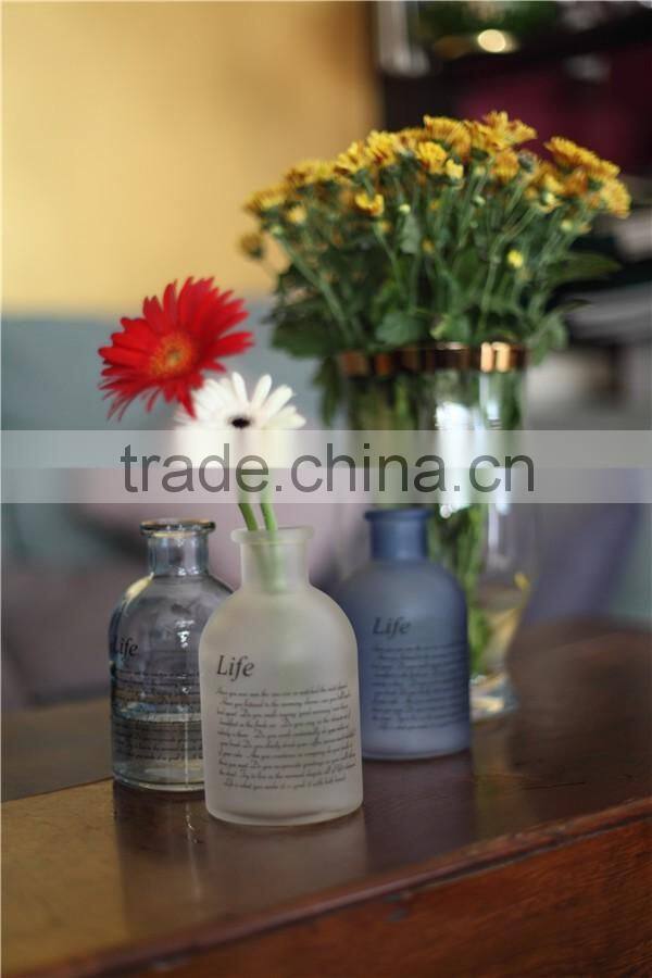 wholesale cheap small round colored glass vase for flower with linen