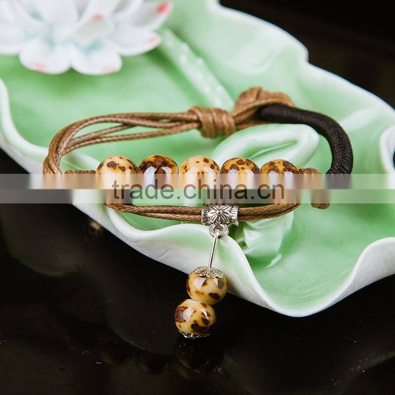 Retro Chinese Red Handmade leather Ceramic bead bracelet with bell on it