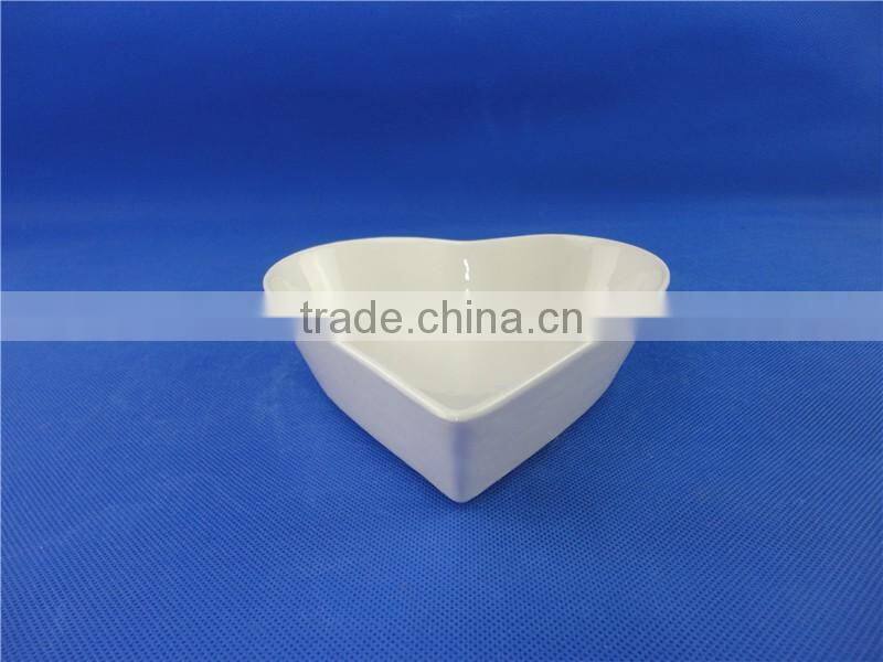 white ceramic heart shaped bowl