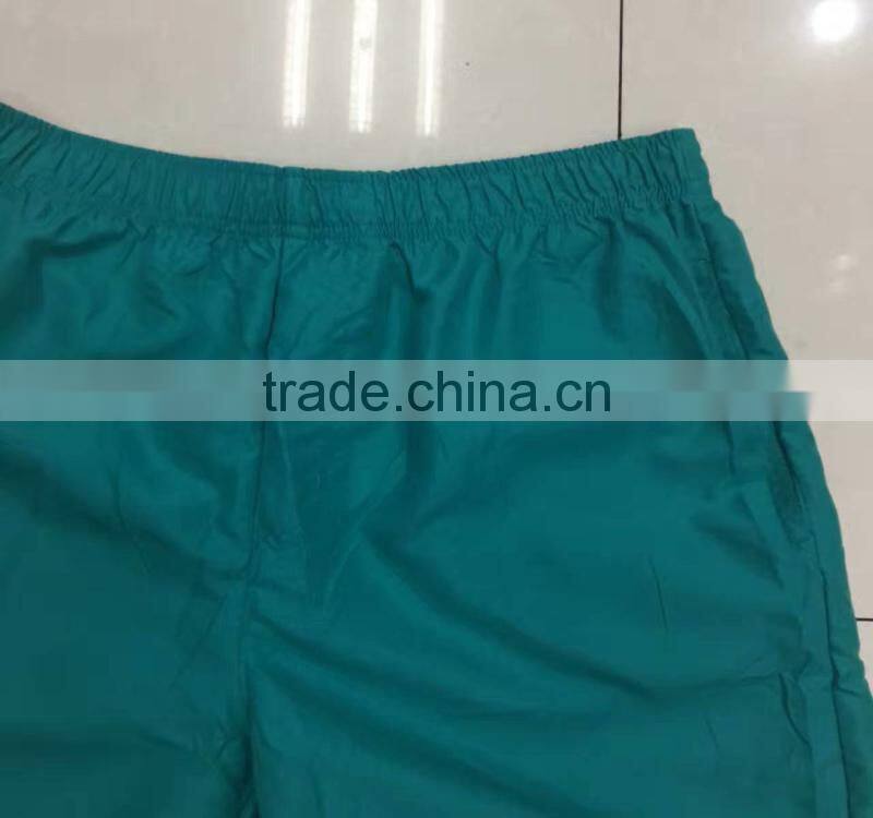 China stocklots men 100%polyester pure color bermuda shorts