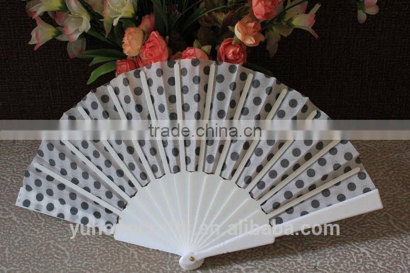 Plastic hand fan with dot design