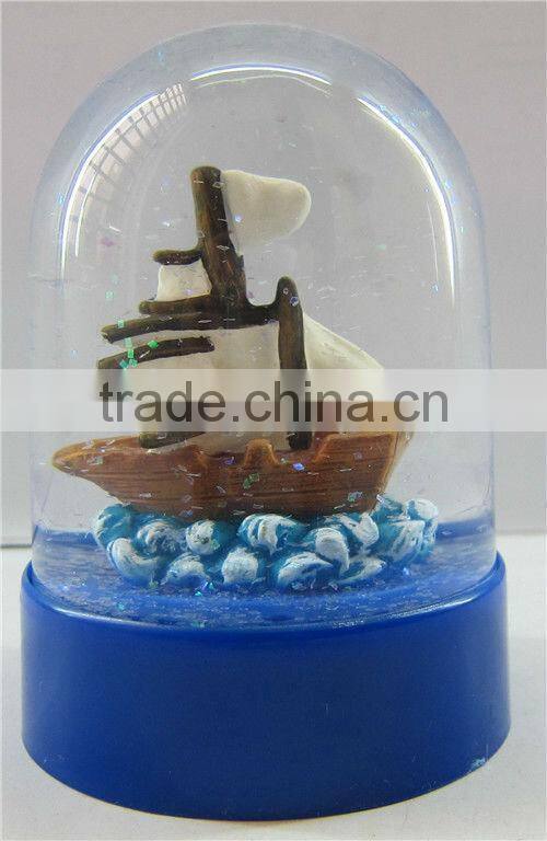 Plastic sea snow globe with boat figurine inner