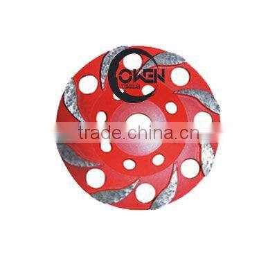 Polliwog shaped seg cup wheel