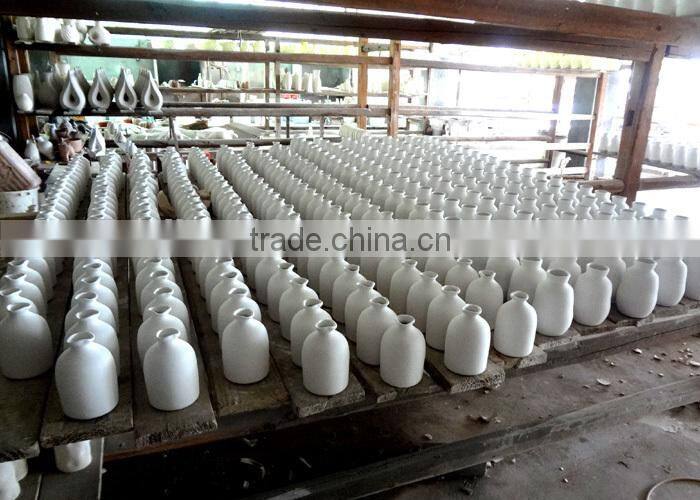 egg shape white stoneware bud vase