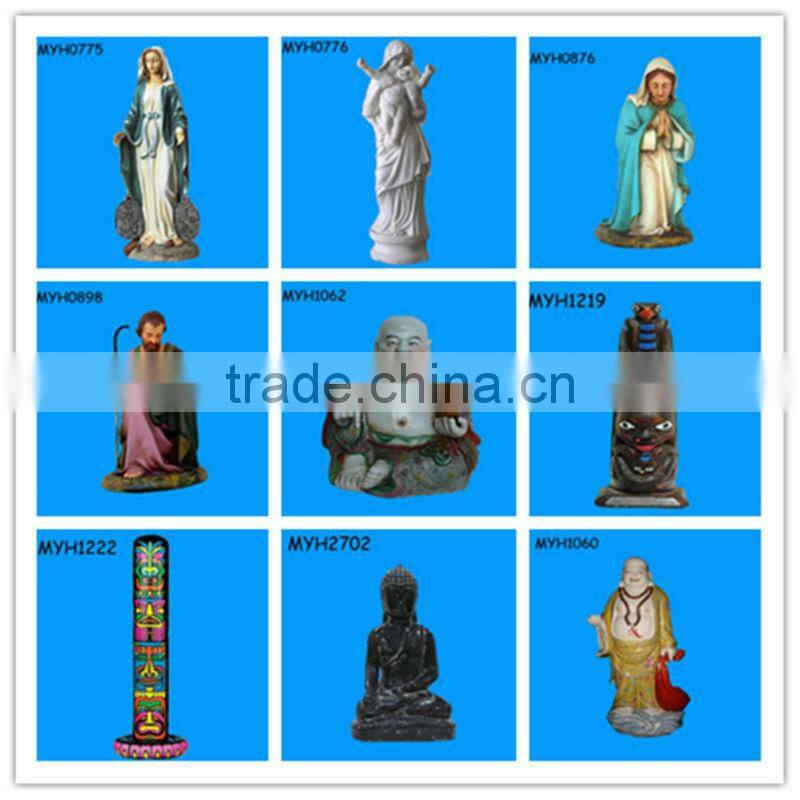 ceramic fat cat statue playing with a blue yarn ball