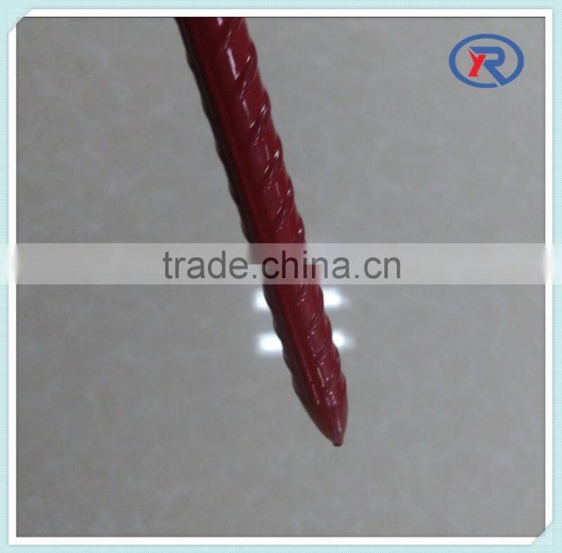 red painted steel picket fence post