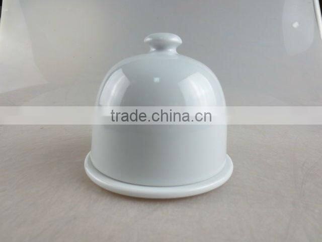 white porcelain bell-shaped butter dish with lid