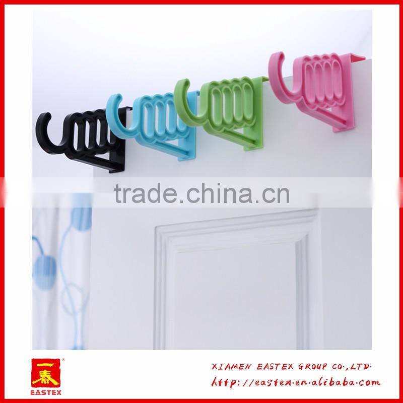 Multipurposed pothook behind the door