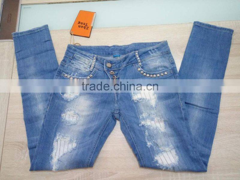 GZY cheap woman fashion Stocklots Women scratch jeans factory