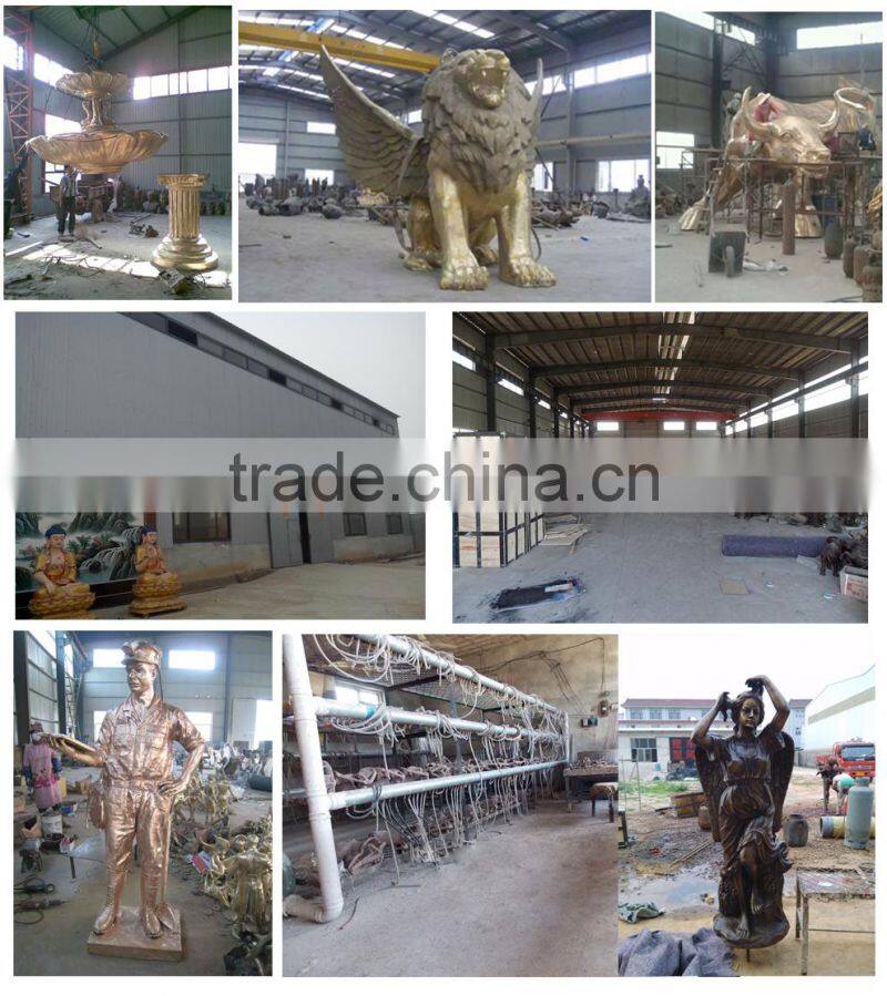 Garden playing boy and girl sculptures with teeterboard