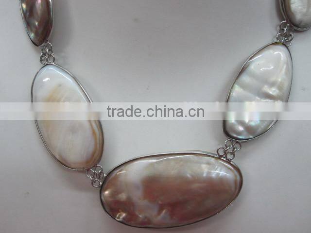 Natural shell bead pendant polished nugget with copper fitting