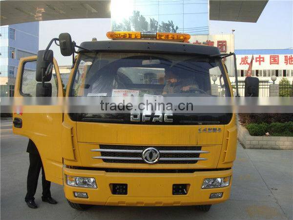 small flatbed towing truck