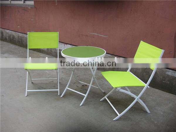 Outdoors round coffee table and folding chairs