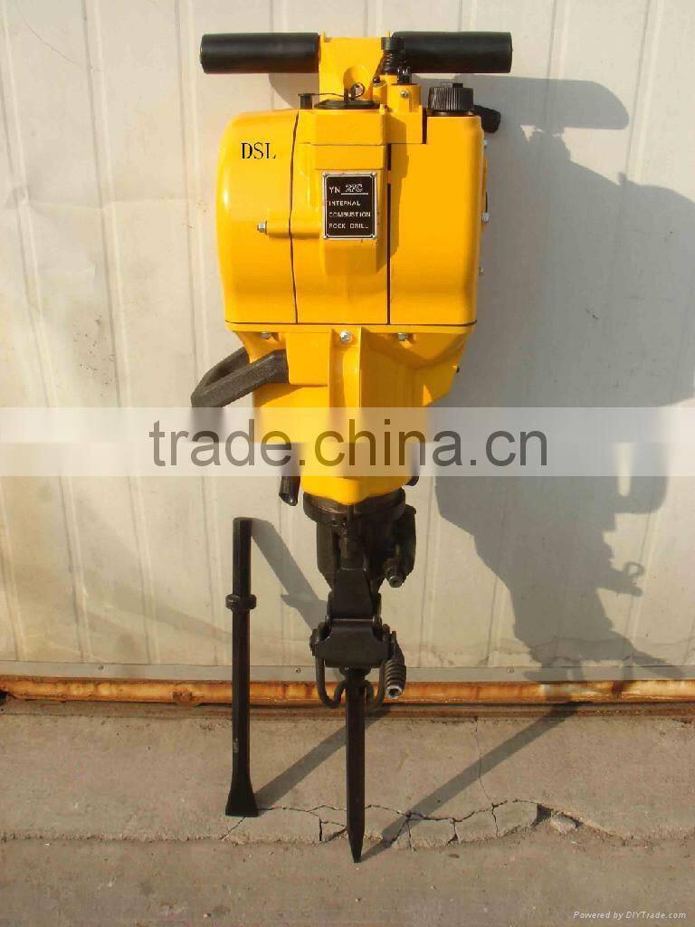 Portable rock drilling machine for rock