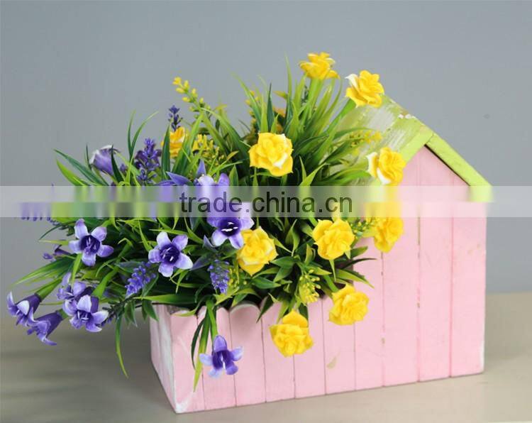Small wooden house flower pot and garden planter