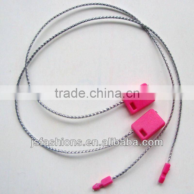 plastic tag with silver shiny string