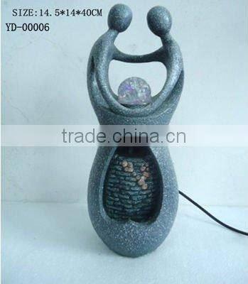 Two men play ball design fountain