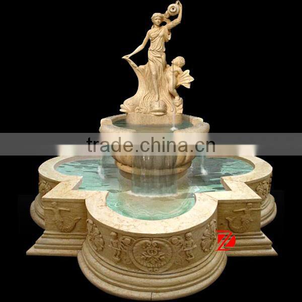 large stone fountain with lady statue