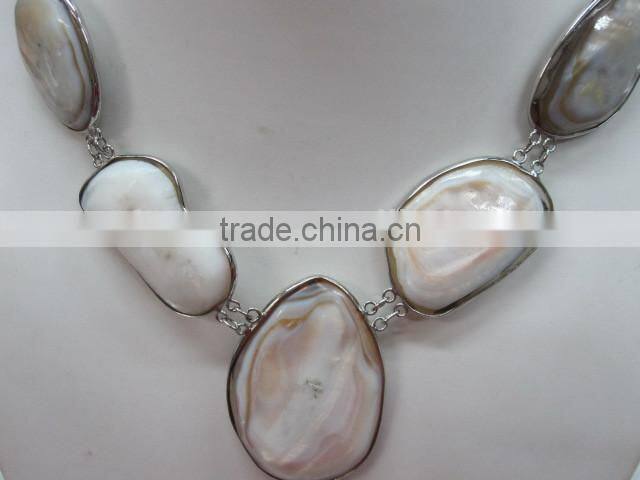Natural shell bead pendant polished nugget with copper fitting