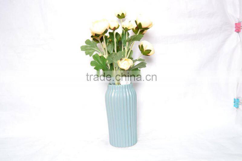 Elegant artificial Rose planted in ceramic pot for decoration
