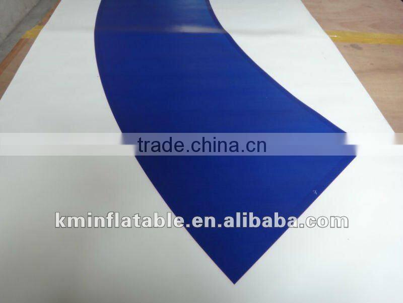 white inflatable arch with black words