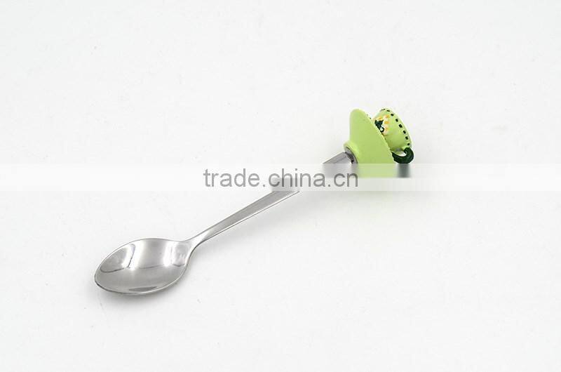 Green colored tea cup handle cake spoon