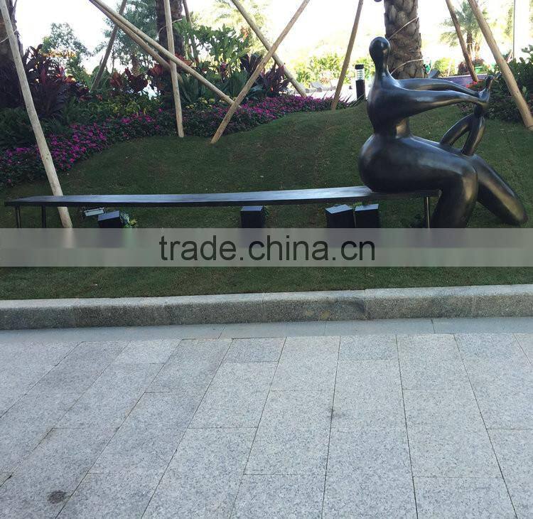 Fiberglass man character on bench
