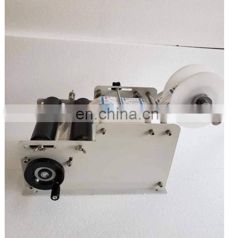 YTK-L100 handheld hand held manual round bottle labeling machine for bottle used,manual round bottle labeler