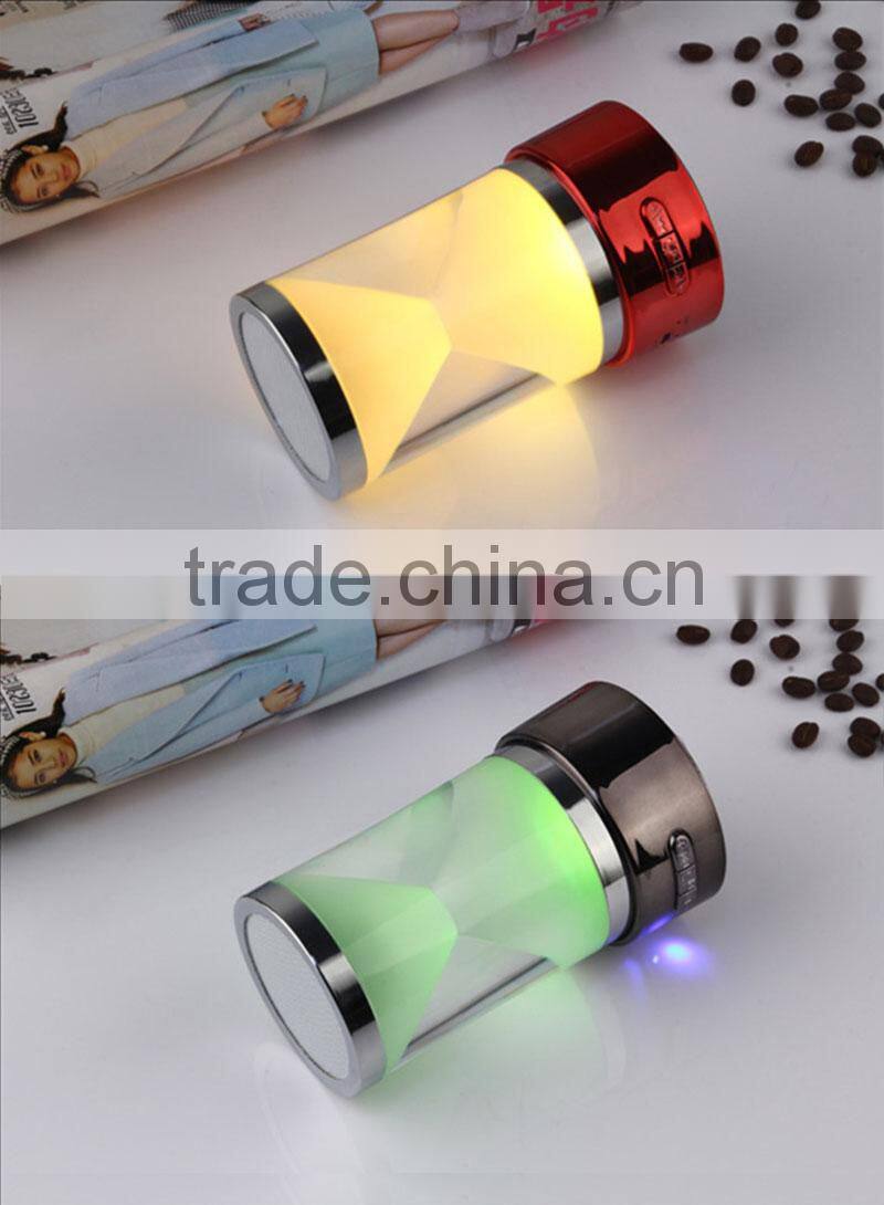 2016 new design hourglass portable wireless music mini bluetooth speaker with magic led light and fm radio/remote