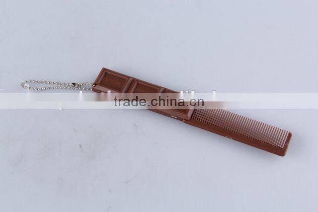 Chocolate shaped hair brush with hanging chain/folding comb