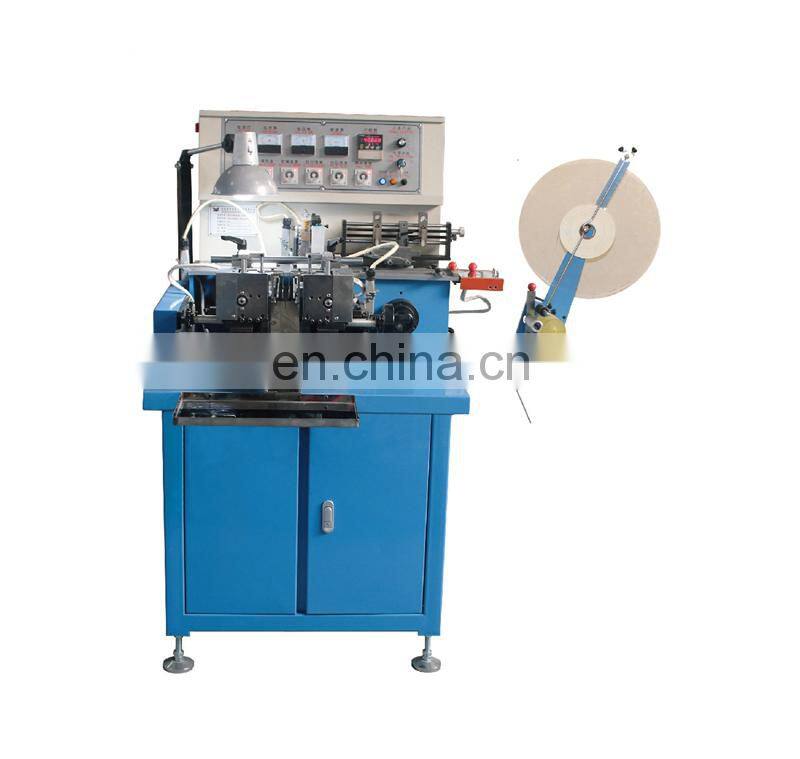 US3100 Automatic hot cold blade knife garment woven fabric label cutting and folding machine, textile ribbon cut fold machinery