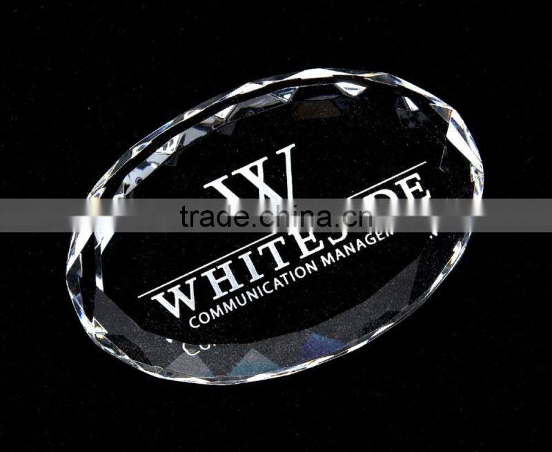 faceted oval crystal paperweight with faceted edge