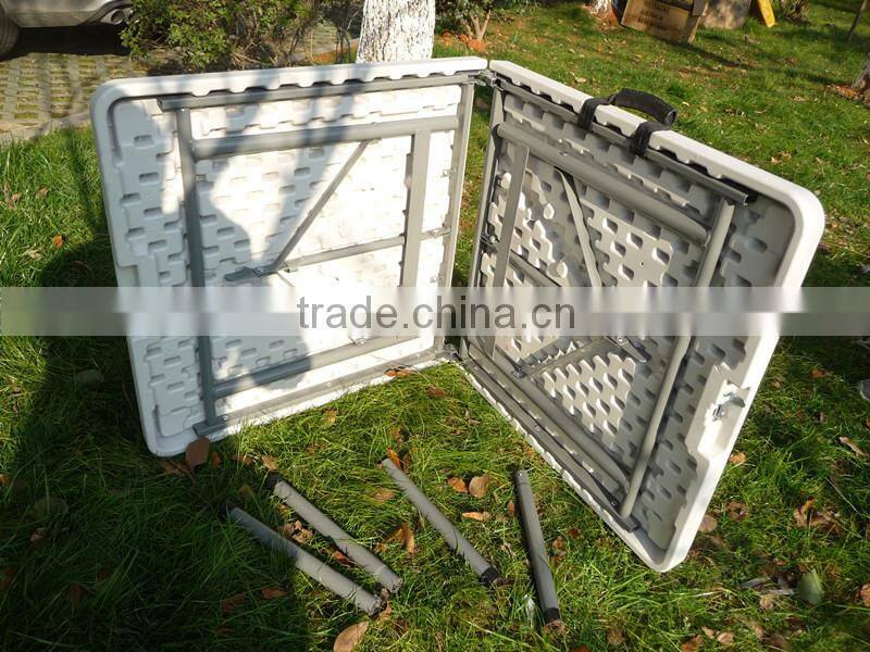 4-foot blow moulded plastic suitcase fold in half table