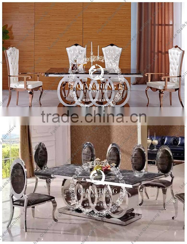 silver stainless steel restaurant dining table with marble top