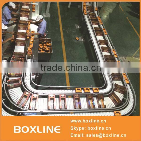 Flexible mesh conveyor for heavy cartons