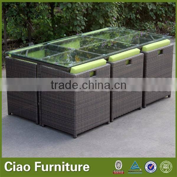 Space saving rattan cube dining table and 6 chairs