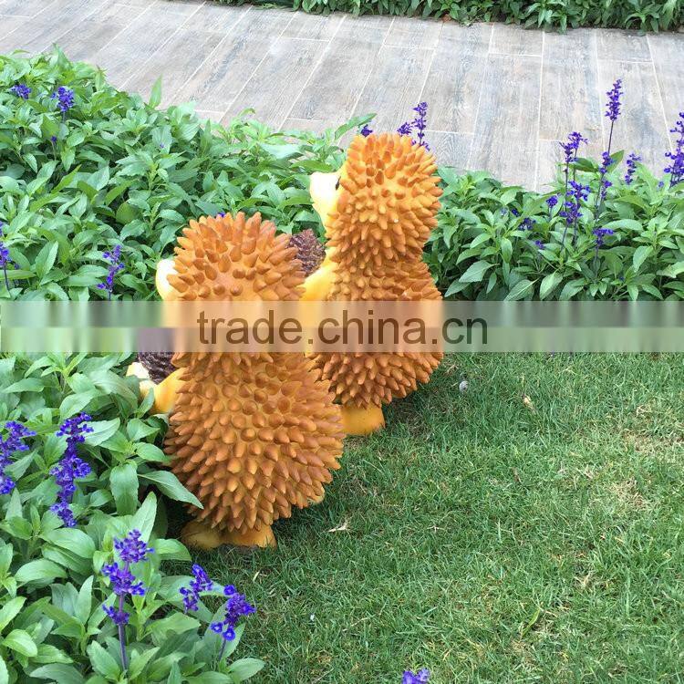 Polyresin squirrel figure in garden
