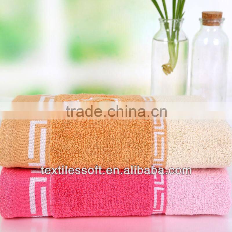 cheap100%cotton terry solid embroidery crown border towel