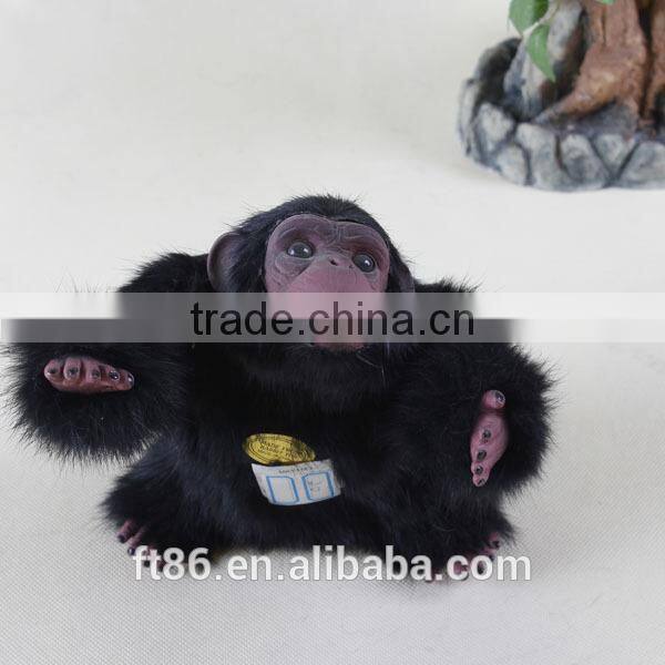 Furry toy looking up lifelike fake animal gorilla