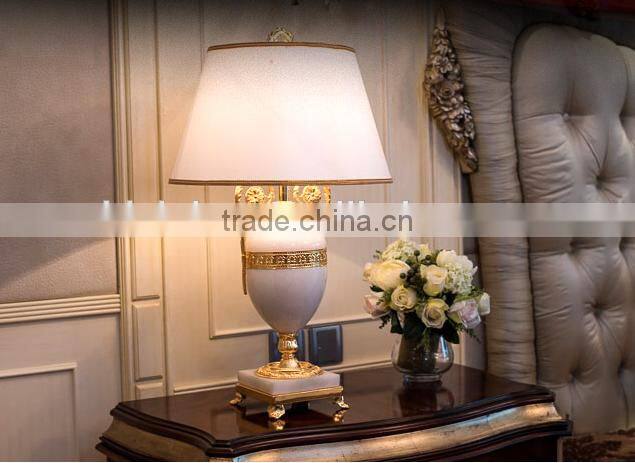Graceful white color jade body brass bottom home use table lamp with fabric lampshade