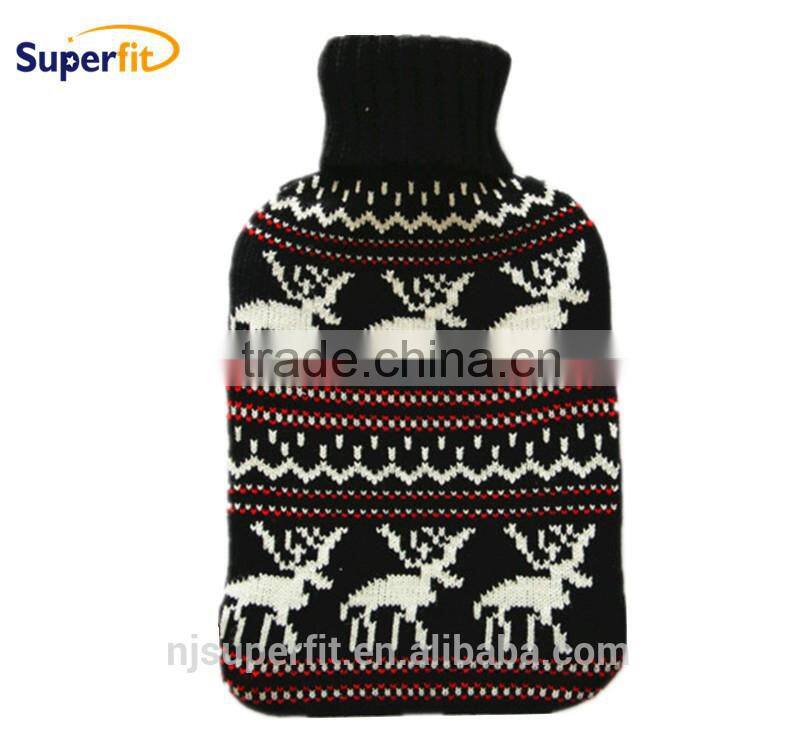 hot water bottle with black white knitted cover