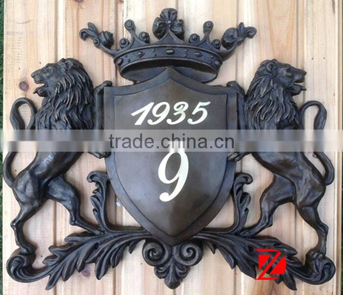 bronze metal doorplate with lion statues