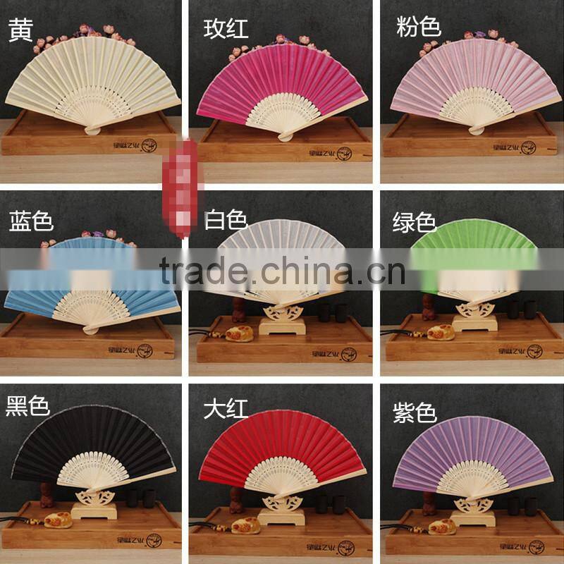 Factory direct bamboo hand fan wedding gift cloth folding hand fan in plain color