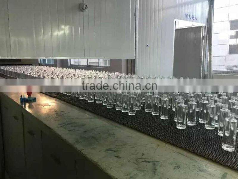 glass perfume bottle with the flower shape cap