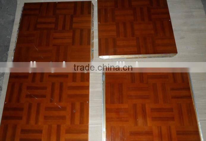 Natural teak wooden dance floor with gold anodized aluminum trim