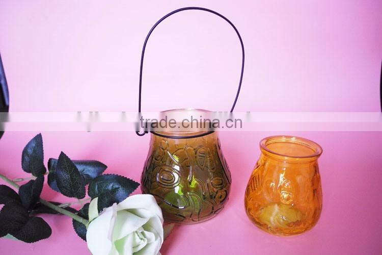geo cut glass candle jar with metal handle