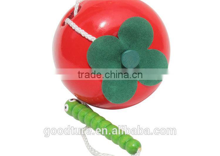 Wooden Caterpillar Eating Red Apple